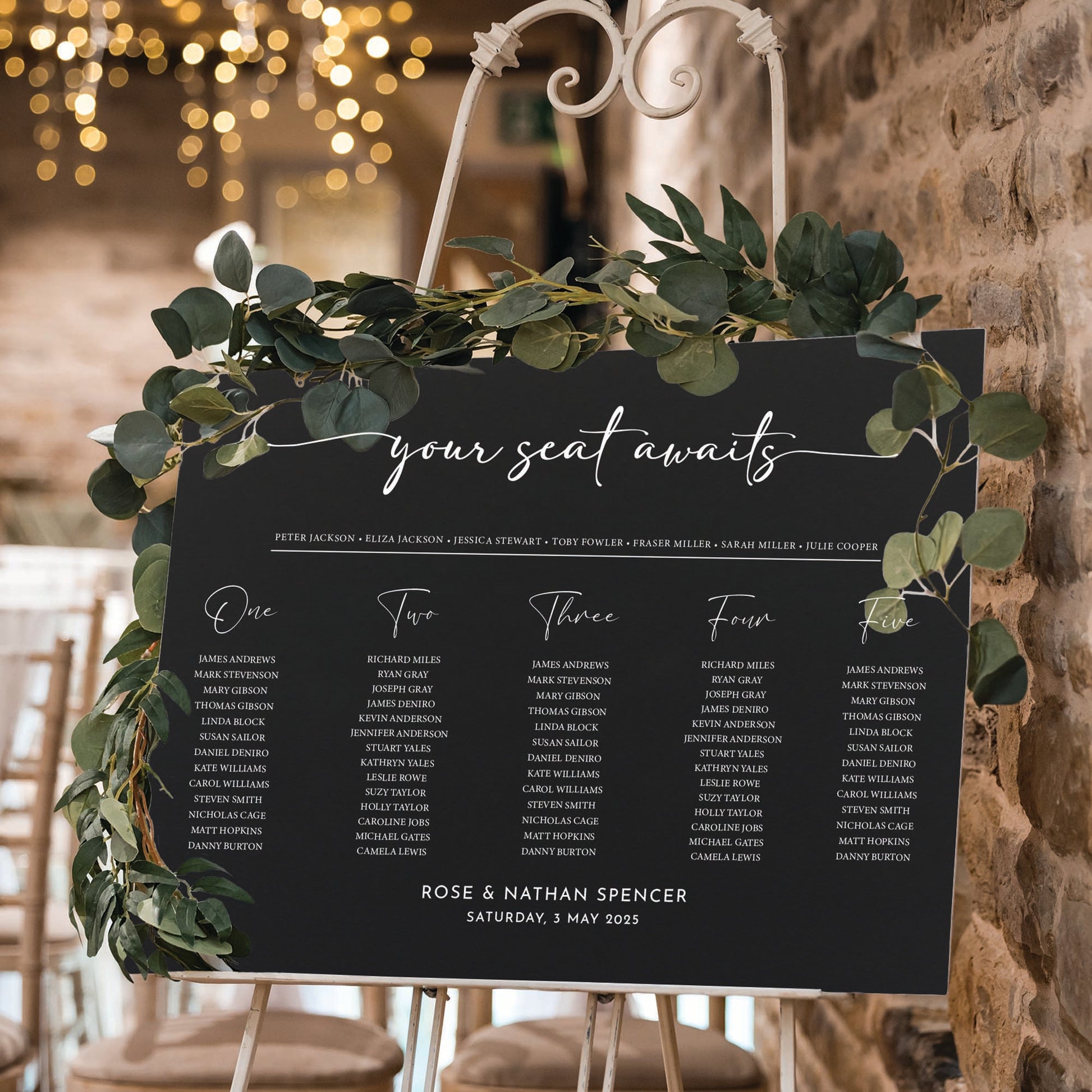 Personalised wedding seating chart in black foam board says your seat awaits