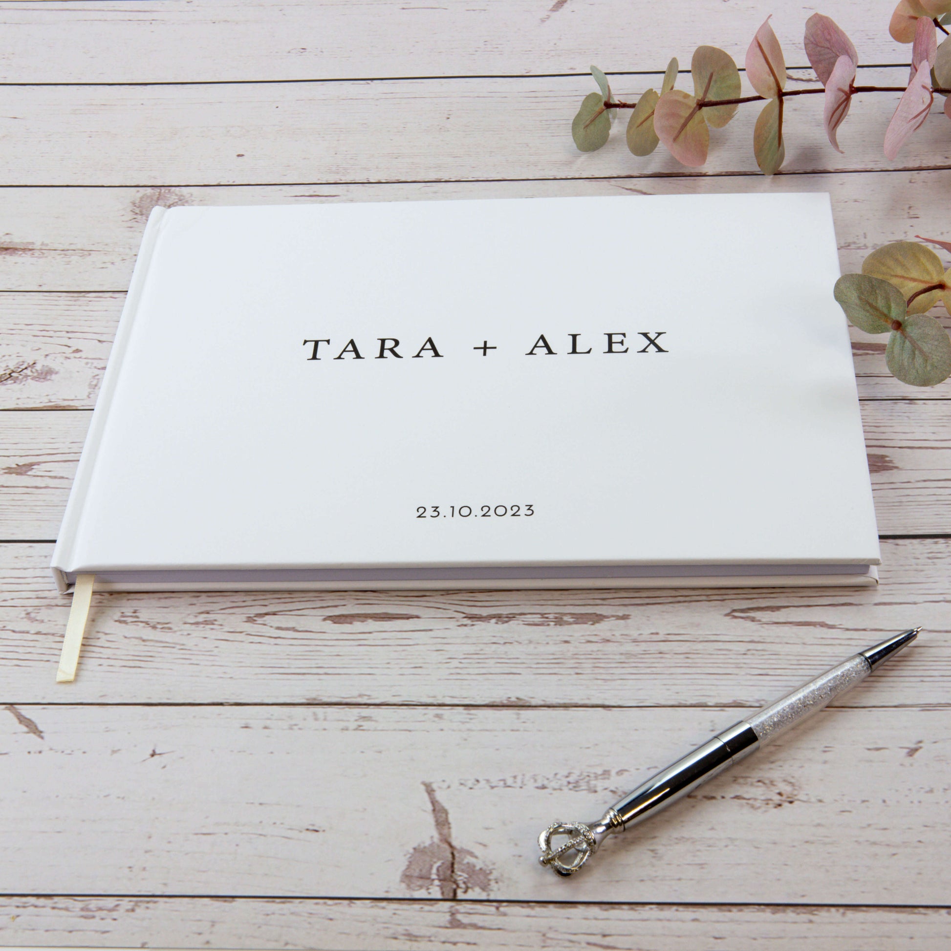 personalised wedding guest book printed 'TARA+ALEX' with the date as '23.10.2023' on it